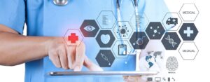 Healthcare worker in scrubs touching a digital interface of medical icons, representing secure healthcare data infrastructure